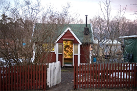 Photo of allotment hut with film projections inside